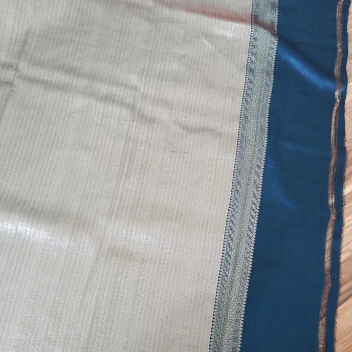 Banarasi Tissue Mix Saree in Patli Pallu Design – Peacock Blue Grid Pleats & Shimmering Silver Tissue Pallu