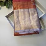 Semi Silk Saree in Rust Copper-Orange with Floral Motifs & Contrast Pastel Lavender Zari Border