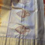 Semi Silk Saree in Rust Copper-Orange with Floral Motifs & Contrast Pastel Lavender Zari Border