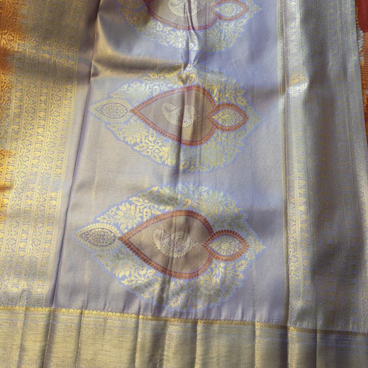 Semi Silk Saree in Rust Copper-Orange with Floral Motifs & Contrast Pastel Lavender Zari Border