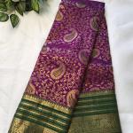 Semi Silk Saree in Royal Purple with Gold Zari Floral Brocade & Contrast Bottle Green Border