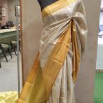 Semi Silk Saree in Silver-White Brocade with All-Over Floral Jaal & Contrast Mustard Gold Border