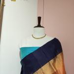 Soft Silk Saree in Soft Mango Peach & Midnight Navy Blue with Temple Zari Border & Peacock Blue Accents