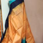 Soft Silk Saree in Soft Mango Peach & Midnight Navy Blue with Temple Zari Border & Peacock Blue Accents